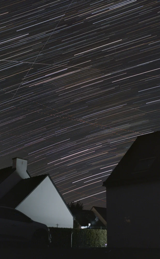 Star trails over a Breton garden, recorded through a full night