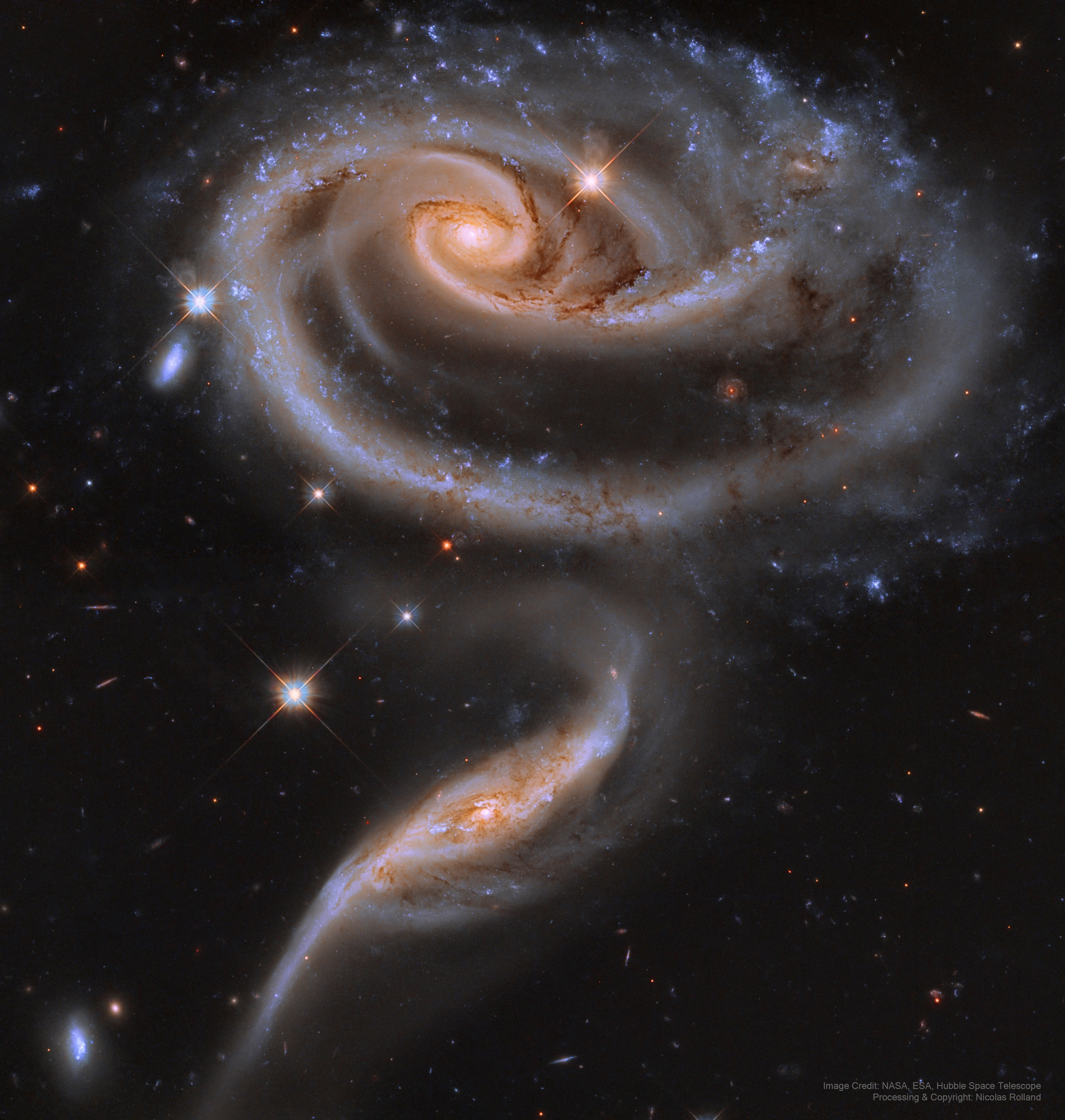 Arp 273, the Rose, two interacting galaxies whose larger disc is warped by its companion