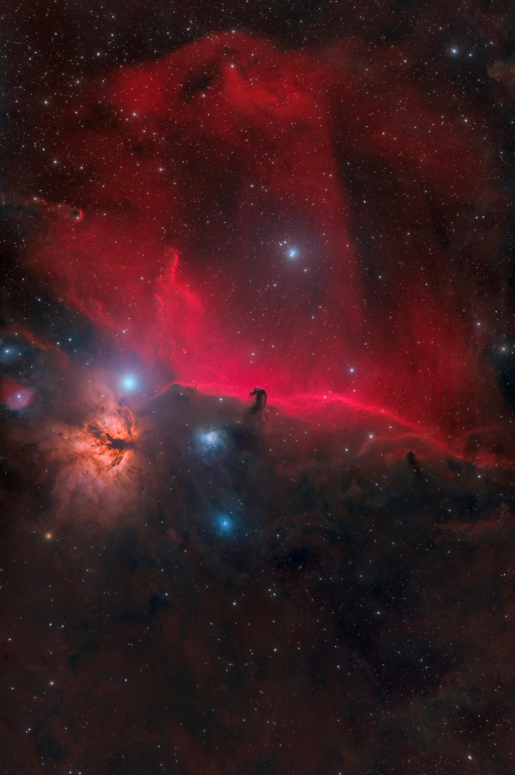 The Horsehead Nebula silhouetted against the emission ridge IC 434, below Alnitak in Orion