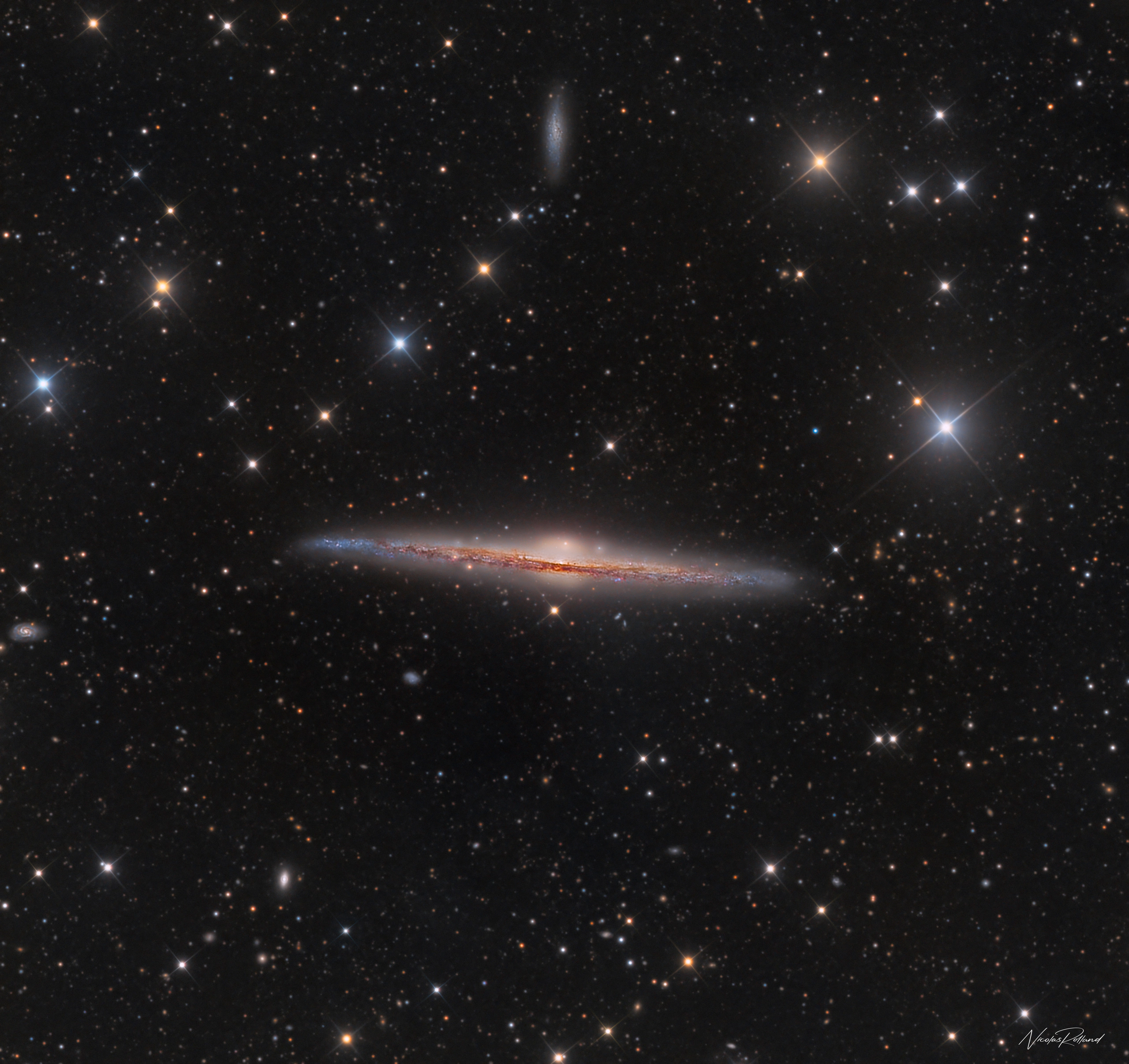 ngc-4565-cluster-lrgb-display The Needle Galaxy NGC 4565, a spiral seen perfectly edge-on in Coma Berenices, in 25 hours of LRGB